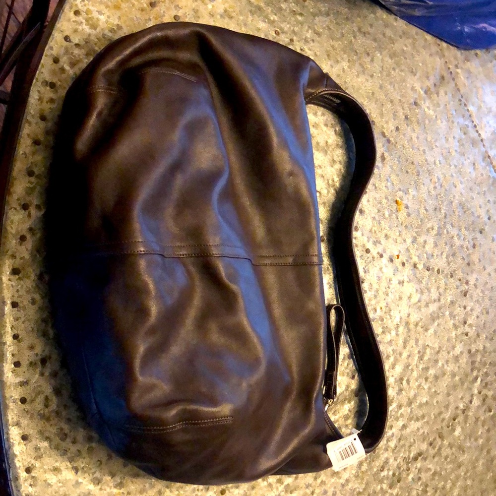 Brown Leather Coach purse. Price tags still on item!